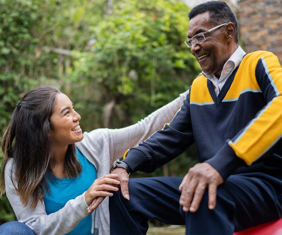 Intern helping a senior with physical therapy